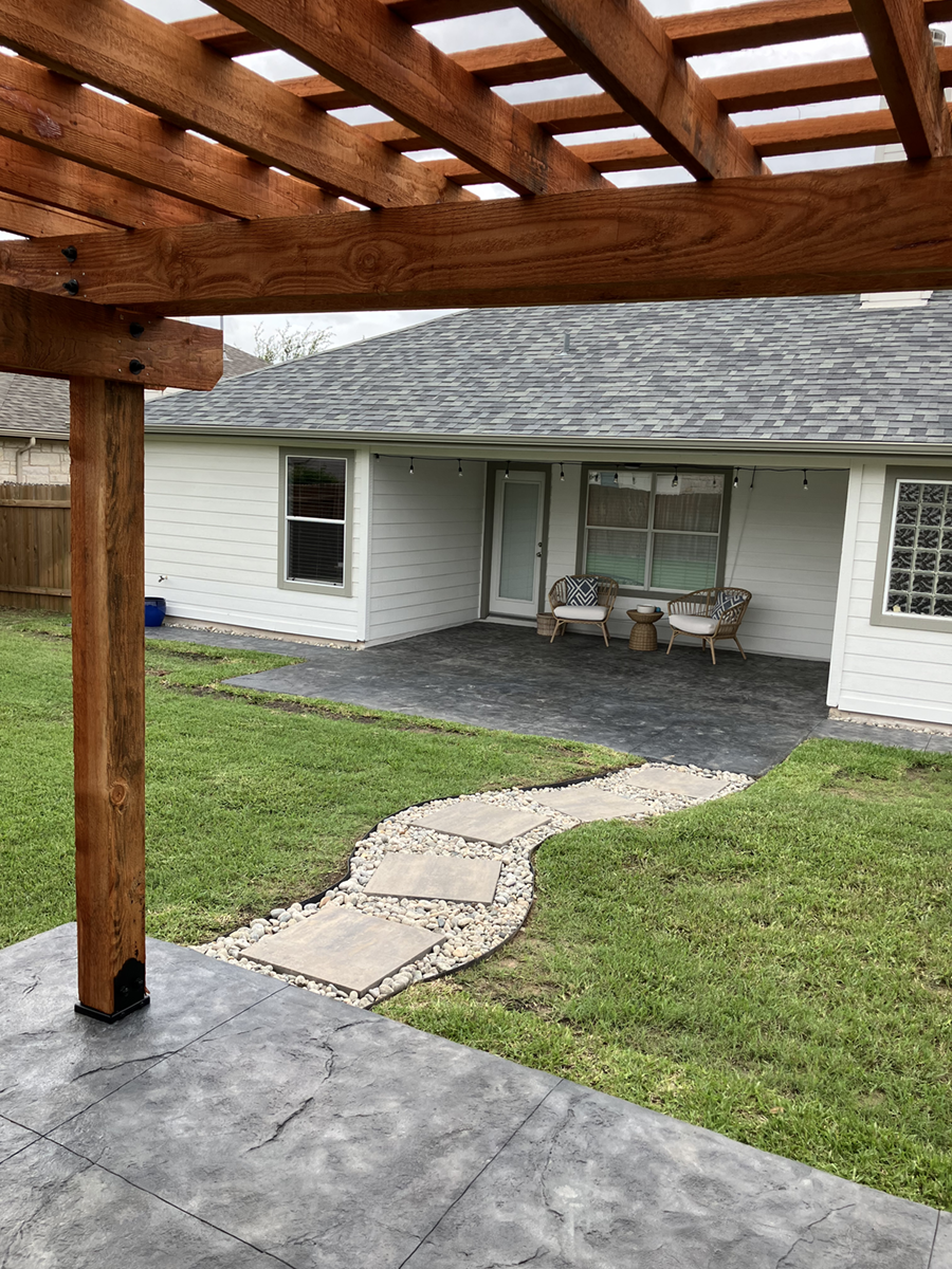 DecorativeConcrete_PfluggervilleTX_1 a modern backyard patio design, perfect for outdoor living enthusiasts